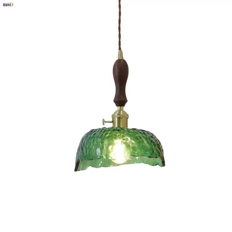 Modern green glass walnut wood pendant light with textured glass, dark wood handle, and brass hardware for dining room