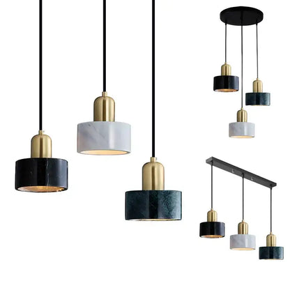 Modern pendant light with sleek black and gold fixtures and green marble cylindrical shades for dining room decorbites green marble
