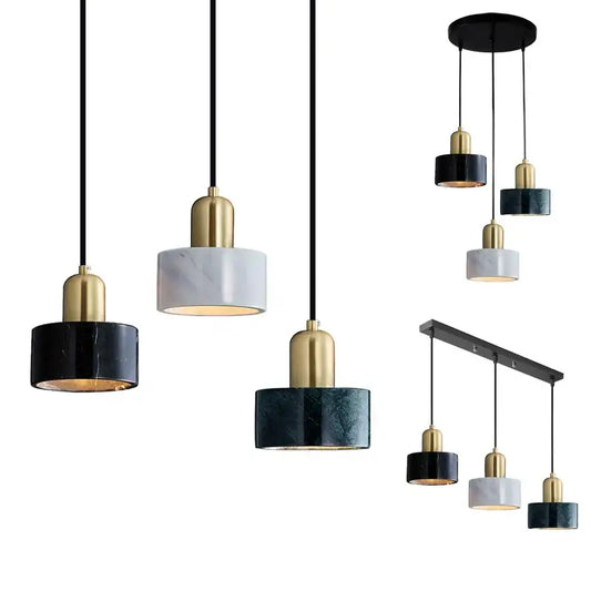 Modern pendant light with sleek black and gold fixtures and green marble cylindrical shades for dining room decorbites green marble