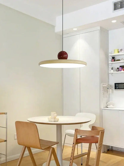 Modern pendant lights with sleek white circular shade and glossy red spherical accent for kitchen decorbites colorful metal led design