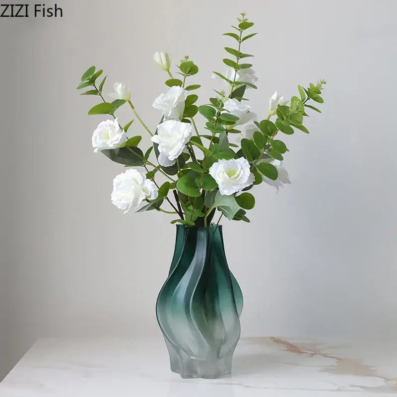Modern green ripple glass vase with translucent teal-green ripple glass holding white roses and eucalyptus for decorbites decor
