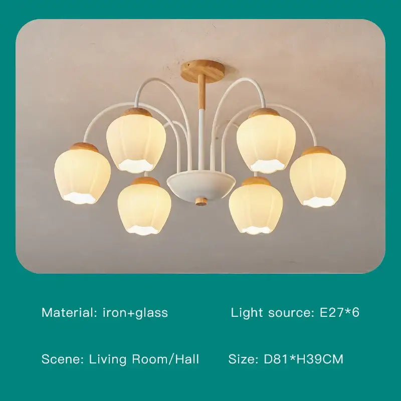 Modern green white chandelier with white and light wood-toned frame and five glass bell-shaped shades for living room