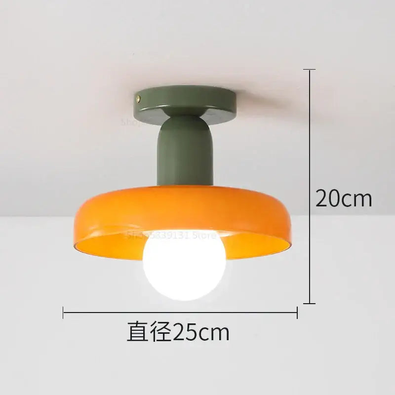 Modern pendant lights with matte olive green base and orange bowl-shaped shade from decorbites colorful glass collection