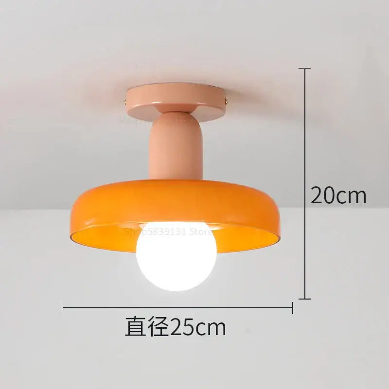 A modern peach matte pendant light with a vibrant orange glass shade 20cm height for decorbites colorful glass pendant lighting
