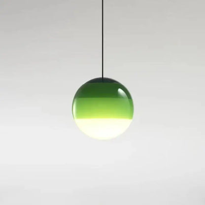 A sleek modern green and white glass ball led pendant with gradient globe and black cord for dining room decorbites lighting