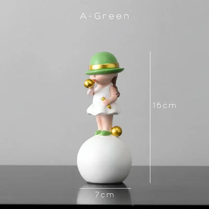 A charming green-hatted figurine in a white dress blowing bubble gum atop a white sphere with gold accents for living room decor