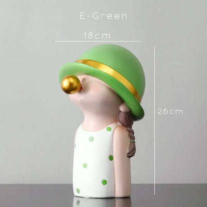 Modern green and white polka dot bubble gum blowing statue with braided hair and gold hat for living room decor
