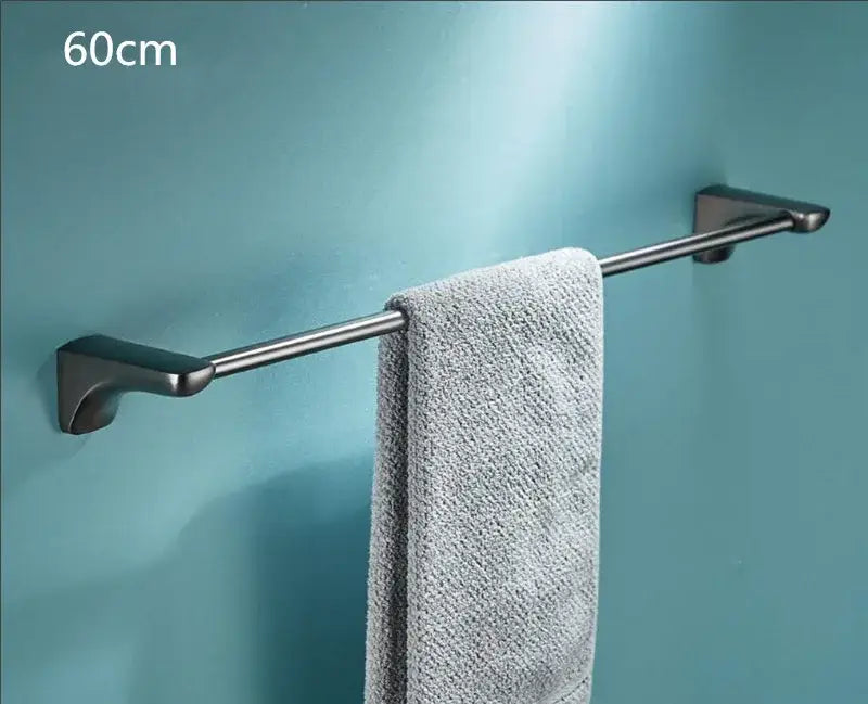 Modern grey bathroom accessories set featuring a silver-toned stainless steel towel rack with a sleek matte finish