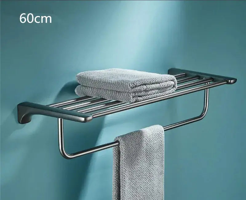 Modern matte black stainless steel towel rack with integrated shelf in decorbites grey bathroom accessories set