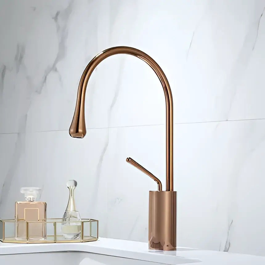 Copper-finished modern gun grey brass basin faucet with sleek curved spout and cylindrical base for kitchen use