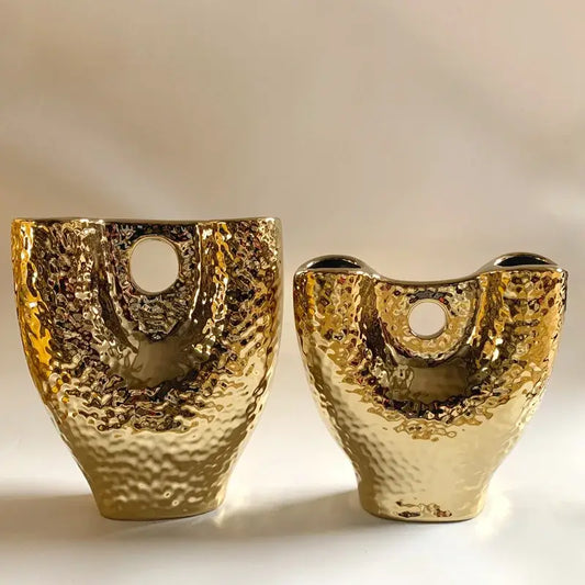 Two modern hammered gold vases with textured ceramic surface and circular openings for living room decorbites gold vase set