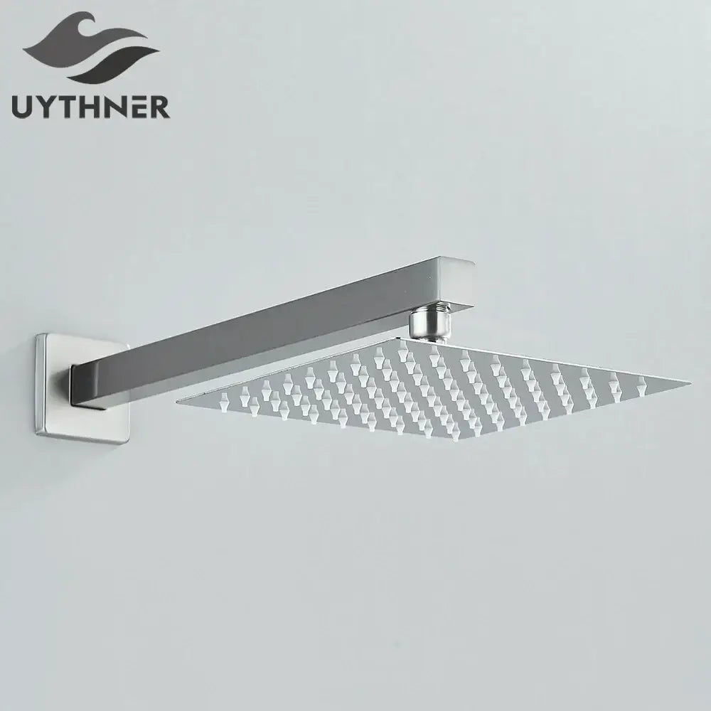 Modern hammered chrome finish square wall mounted shower head with sleek geometric nozzle design for bathroom accessory