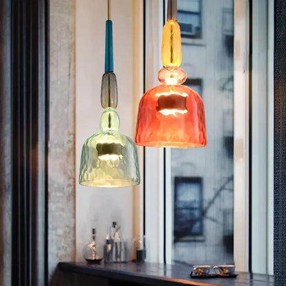 Two colorful textured glass bedside pendant lights with modern design hang from the ceiling for decorbites glass bedside use