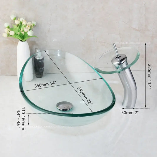 Clear glass vessel sink with sleek modern design and chrome basin mixer faucet for bathroom use