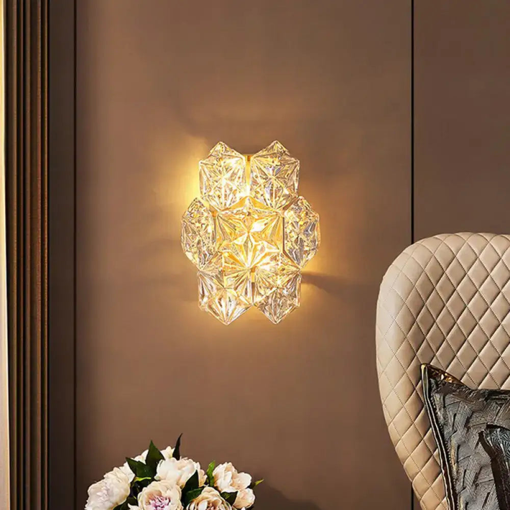 Modern hexagon gold finish crystal wall light with faceted glass design emitting warm light for e12 e14 bulbs