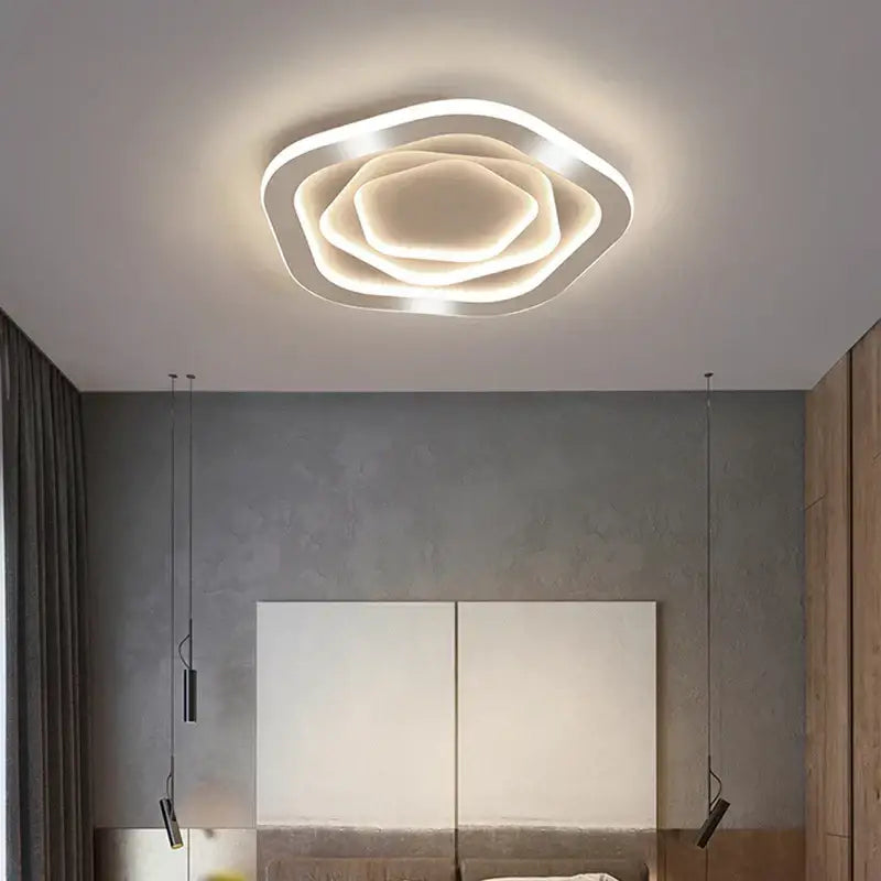 Modern white led ceiling light with layered petal design paired with decorbites gold luxury led chandelier for living room
