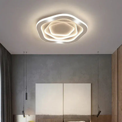 Modern white led ceiling light with layered petal design paired with decorbites gold luxury led chandelier for living room