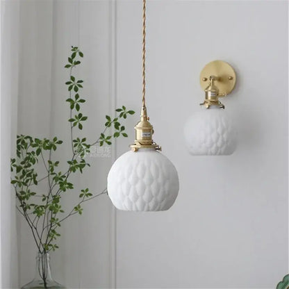 Modern honeycomb brass ceramic led wall sconce featuring white textured glass and gold-toned decorbites ceramic led hardware