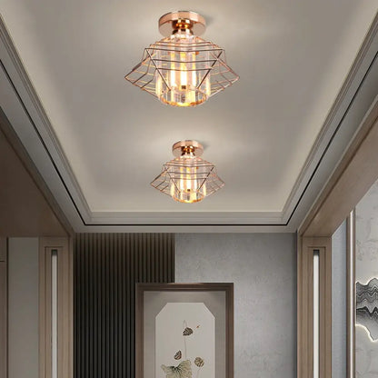 Two rose gold geometric cage ceiling lights with clear glass and exposed filament bulbs for decorbites crystal ceiling chandelier