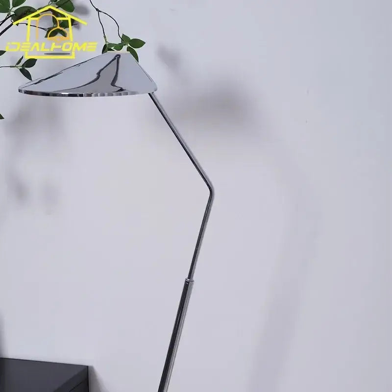 Modern chrome floor lamp with sleek angular design and adjustable arm for decorbites iron art decorative living room use