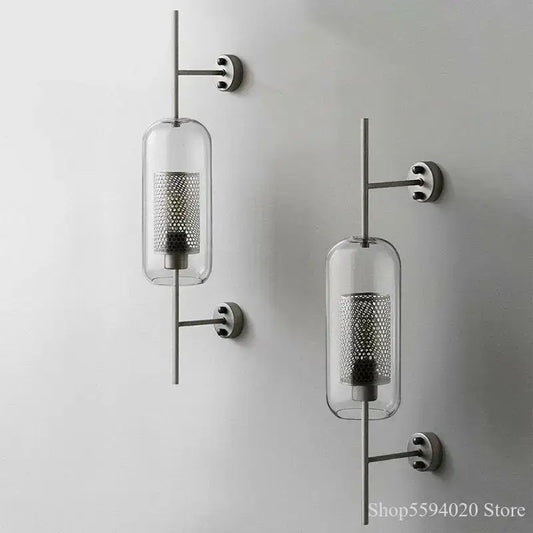 Modern industrial chrome glass wall lights with clear glass cylindrical shades and perforated metal inserts for living room decorbites glass industrial sconces
