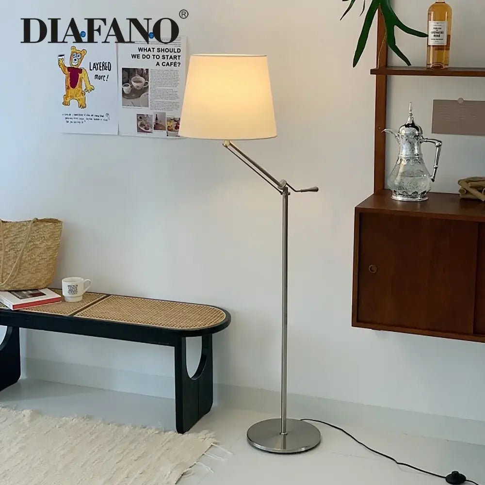 A sleek modern industrial metallic decorbites adjustable led floor lamp with cream fabric shade for living room decor