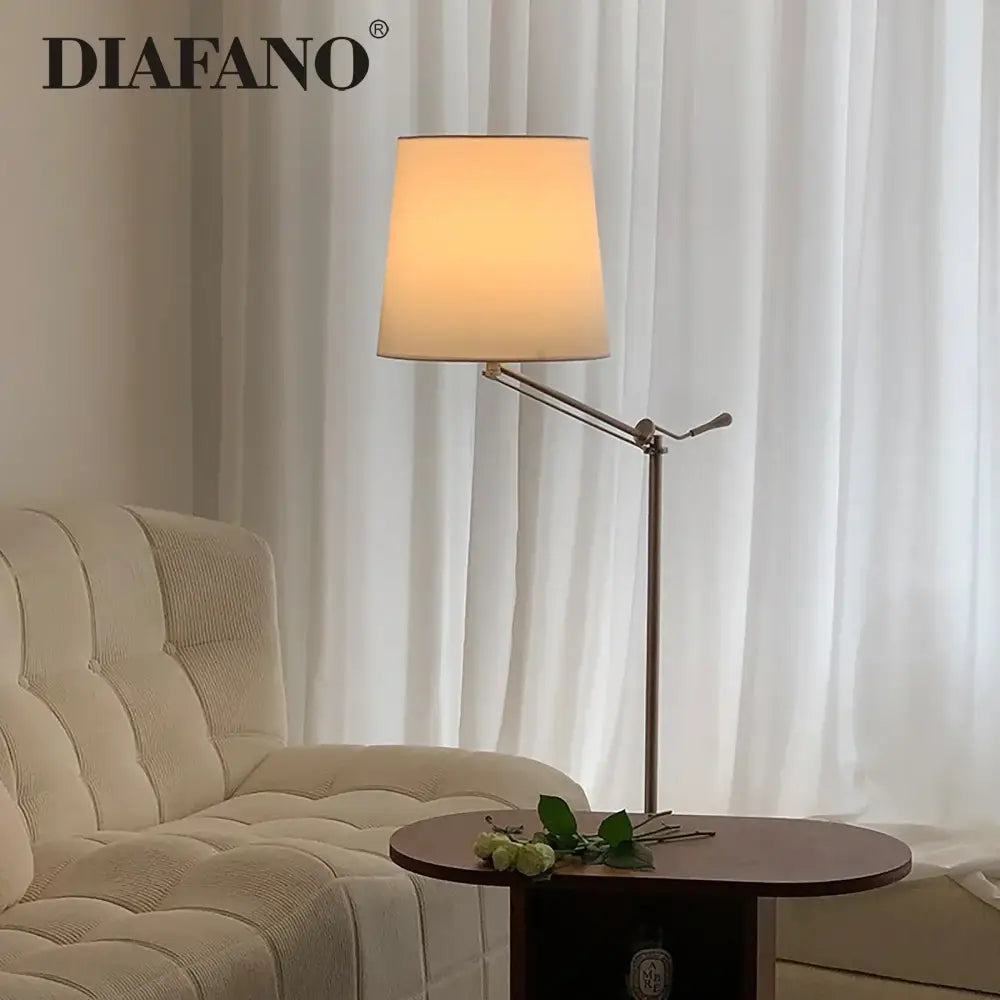Modern industrial metallic adjustable led floor lamp with warm-toned fabric shade for living room decorbites floor lamp