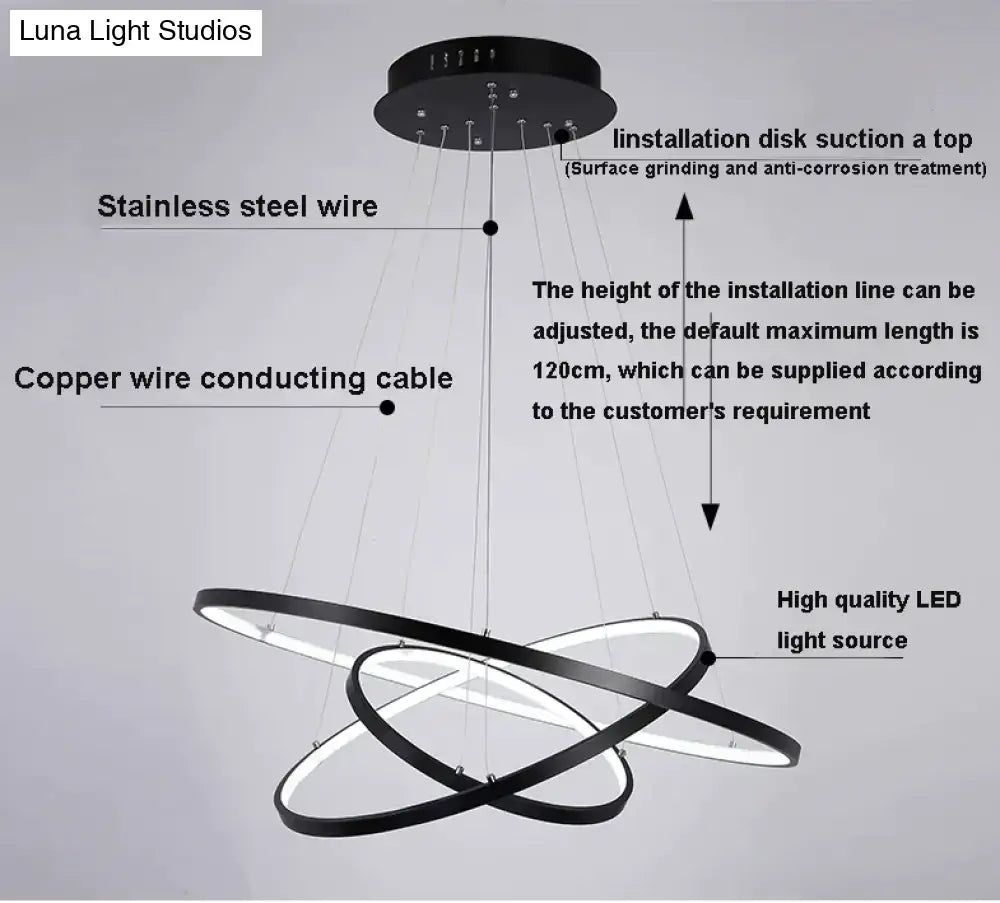 Modern black circular led pendant lights with sleek interlocking rings and stainless steel wire suspension for dining room