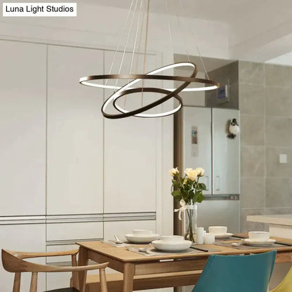 Modern black interlocking ring pendant lights with illuminated led strips designed for dining room use