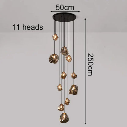 Black iron pendant light with 11 golden glass pendants cascades as a statement piece focal point for dining rooms