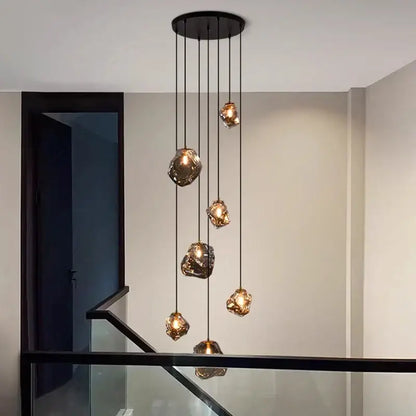 Modern iron and glass 6 light pendant light with amber gold globes as a dining room statement piece focal point