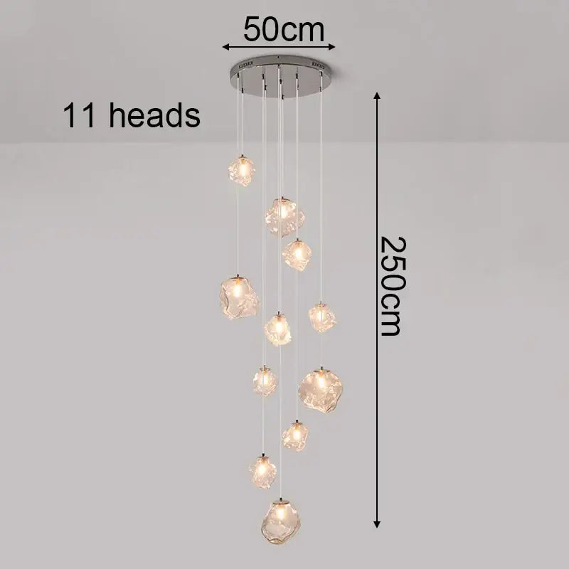 Modern iron and glass pendant light with eleven cascading crystal glass lights on a sleek metallic base as a dining room statement piece and focal point