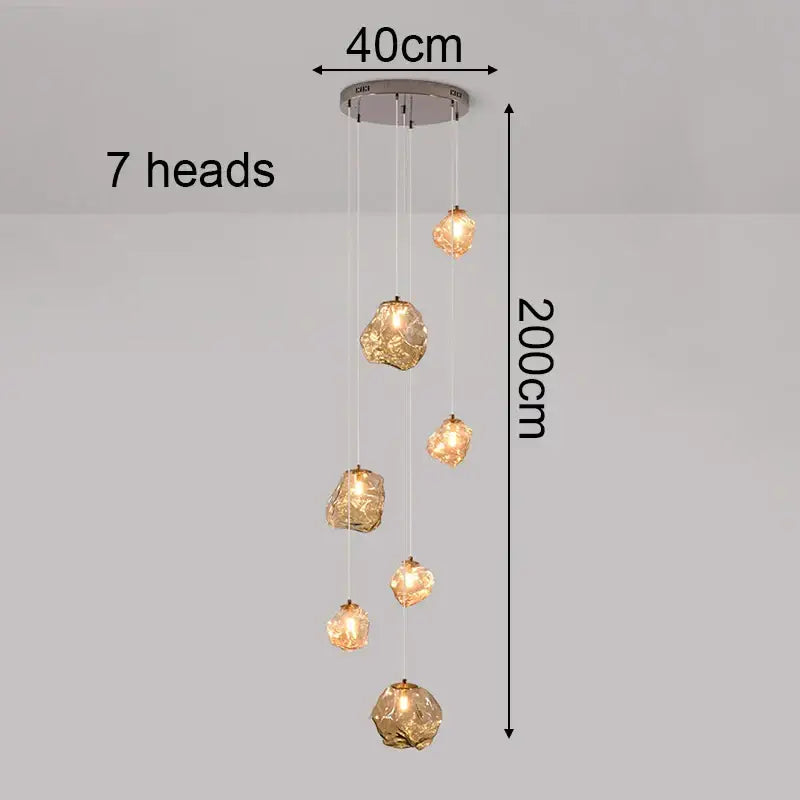 Modern iron and glass pendant light with seven amber gold globes and chrome mount as a dining room statement piece