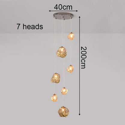 Modern iron and glass pendant light with seven amber gold globes and chrome mount as a dining room statement piece