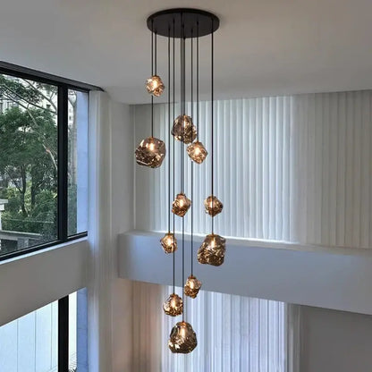 Modern iron and glass pendant light with golden globe lights and black ceiling mount as a dining room statement piece
