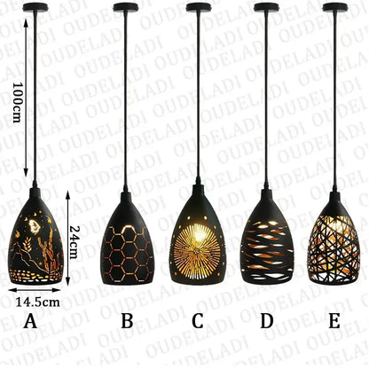 Five modern black iron cage pendant lights with unique cut-out patterns illuminate a dining room decorbites iron cage pendant