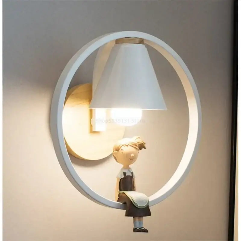 Modern iron led wall lamp in white with a child figurine in overalls sitting on the iron led wall decorbites frame