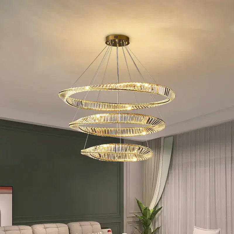Modern irregular gold steel pendant light with three-tiered crystal rings and warm glow for dining room decorbites irregular gold