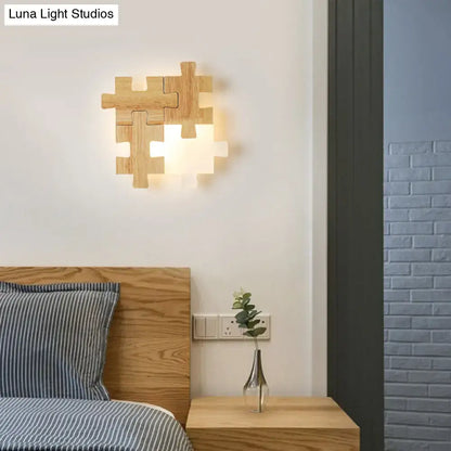Modern jigsaw light wood wall lamp with warm LED lighting sconce ideal for bedroom ambient lighting