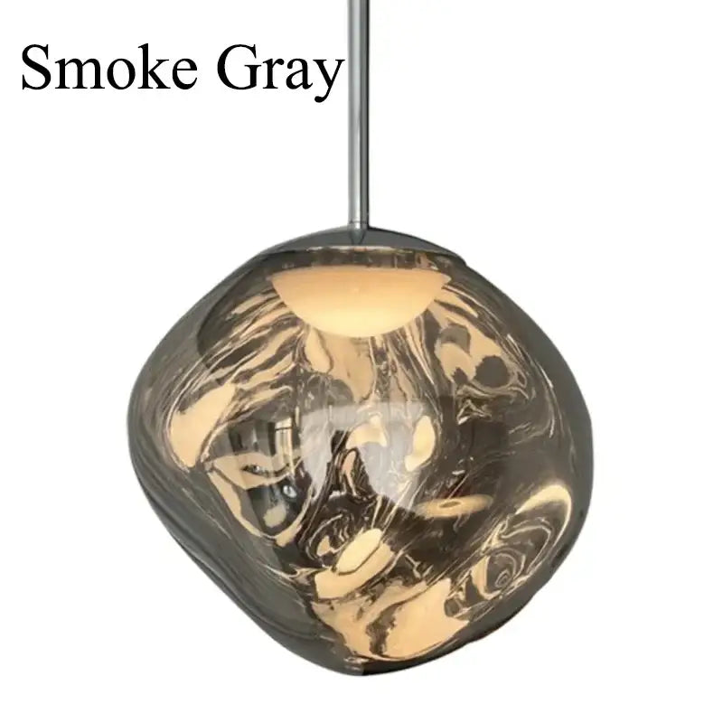 Modern lava glass pendant light with smoke gray swirling patterns and polished chrome finish for dining room lighting