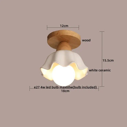 A charming white ceramic flower-shaped ceiling light with natural wood base for warm decorbites clear glass led lighting