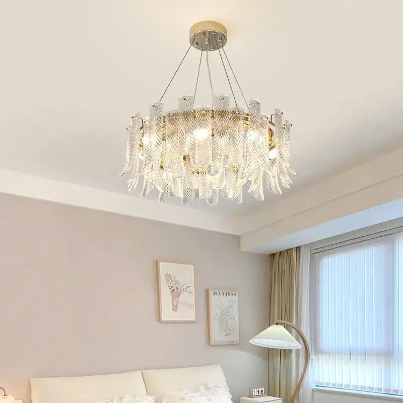 A modern crystal led ceiling lamp with clear leaf textured glass and gold-toned metal accents for living room decorbites crystal led