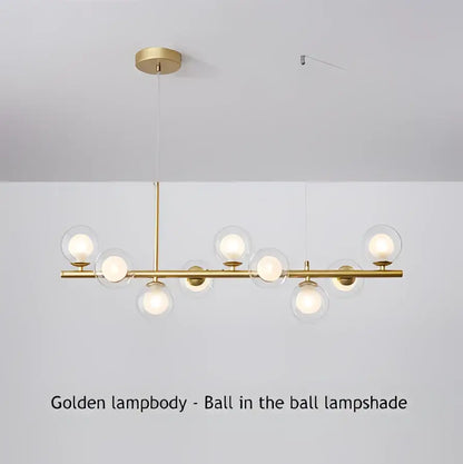Golden pendant light with spherical glass lampshades and polished brass rod in a modern chandelier decorbites™ 9-light design