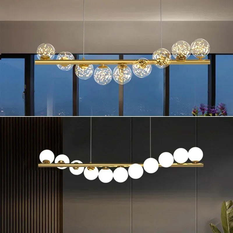 Modern led long gold-toned ceiling chandelier with spherical glass globes featuring warm and opaque lighting options