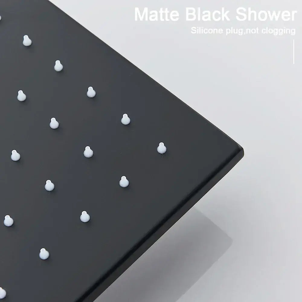 Matte black modern led rainfall shower head panel with evenly spaced white silicone plugs for luxury bathroom use