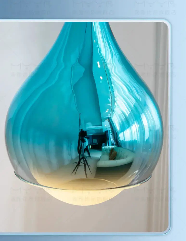 Modern led water droplet ceiling chandelier featuring a sleek translucent blue glass pendant light for bedroom decorbites led water