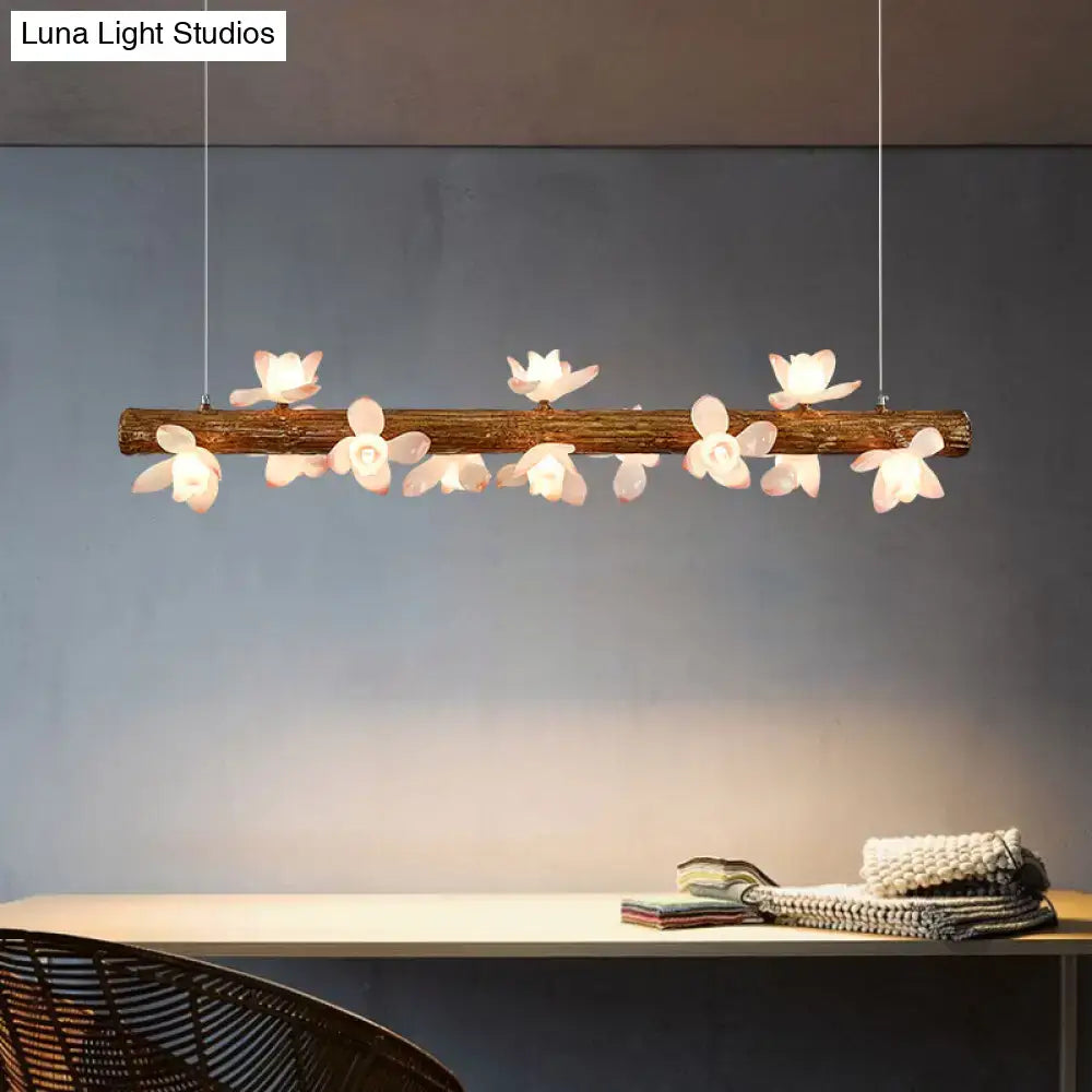 DecorBites Brown modern linear island pendant metal lamp with rustic wooden branch and white flower-shaped lights
