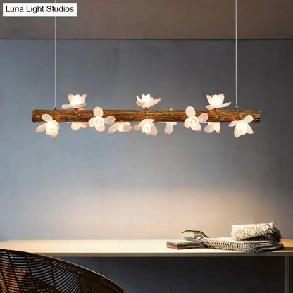 DecorBites Brown modern linear island pendant metal lamp with rustic wooden branch and white flower-shaped lights