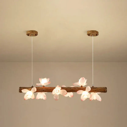 DecorBites™ brown modern linear island pendant metal lamp with rustic wooden branch and pink flower-shaped lights