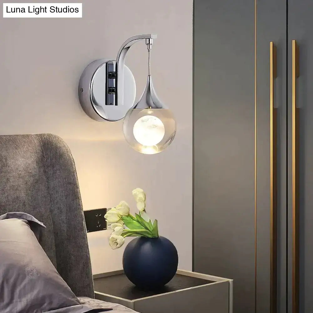 Modern luxurious crystal led wall sconce with chrome finish and teardrop glass globe for elegant bedroom lighting